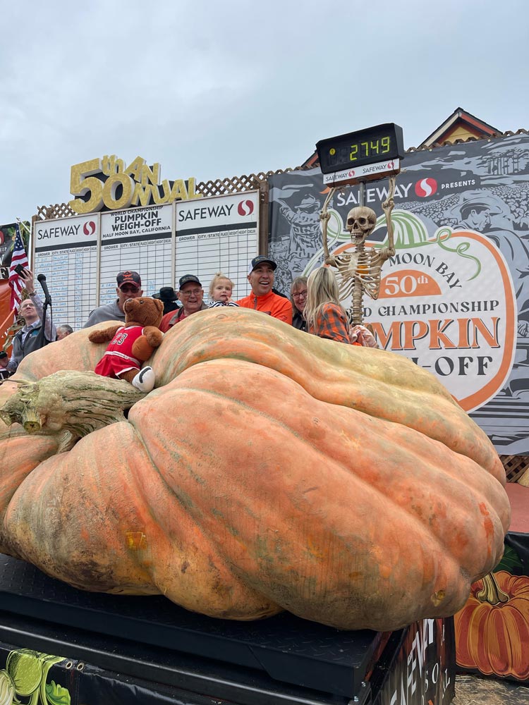2023 Weigh-Off winner Travis Gienger and family celebrate world record breaking pumpkin