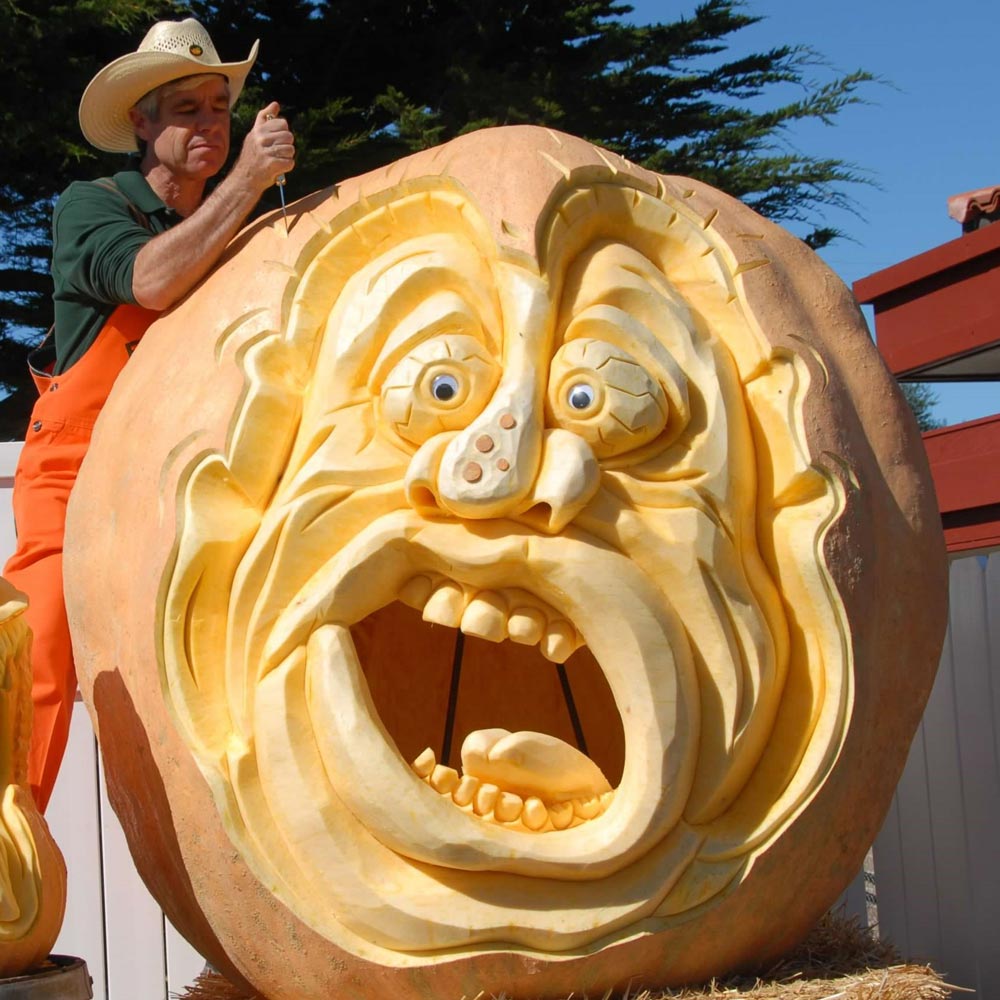 Farmer Mike carves pumpkins at the annual festival
