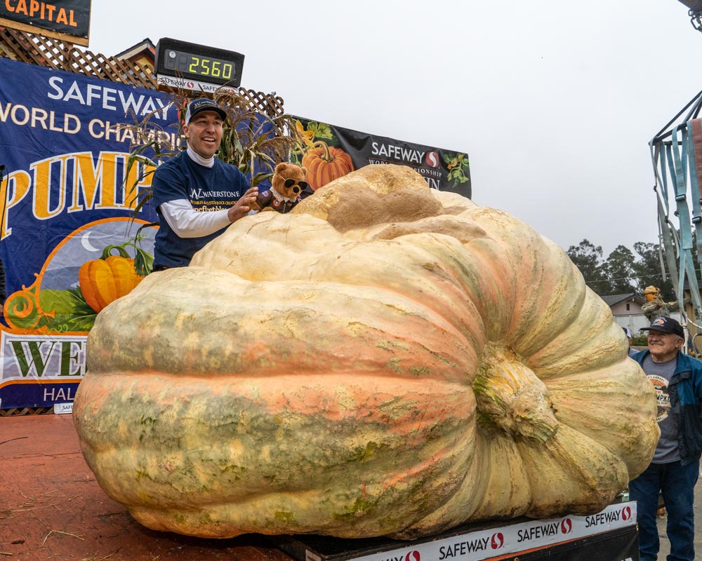 2022 Pumpkin Weigh-Off champion Travis Gienger with his 2560-pound, new North American record winning gourd