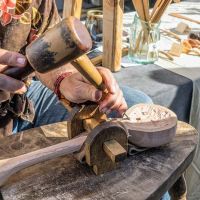 Woodworker demonstrates ladle carving
